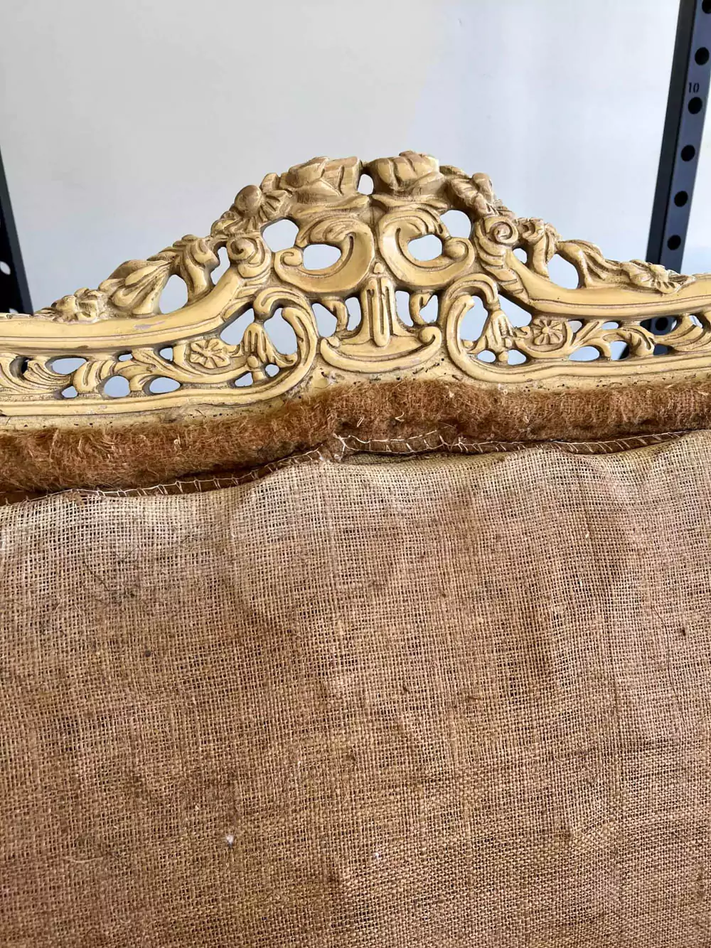 deconstructing antique couch detailing on wood