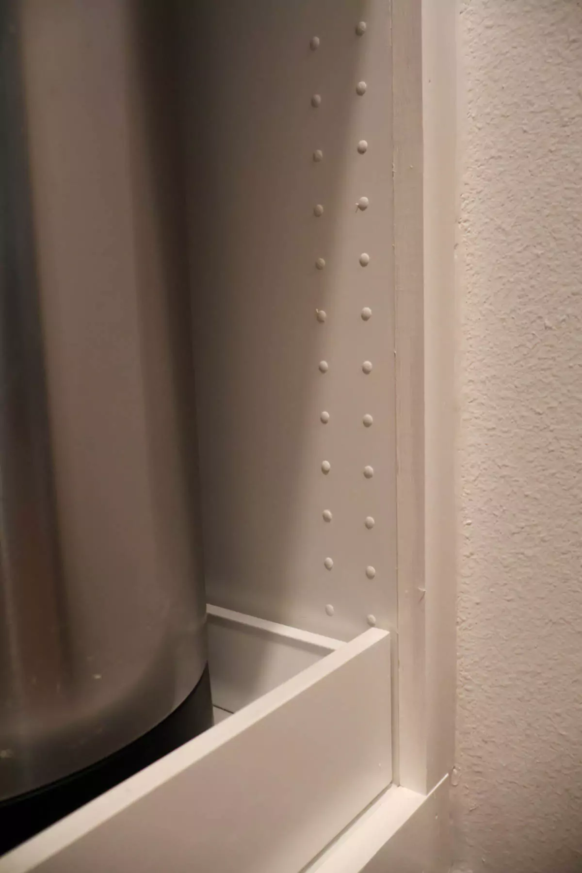 Filled Ikea holes with plastic tabs